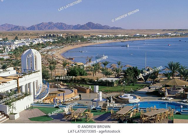 Red Sea. Sinai Peninsula. Na'ama Bay. Buildings/ hotels. Diving centre. Beach. Jetties. Boats