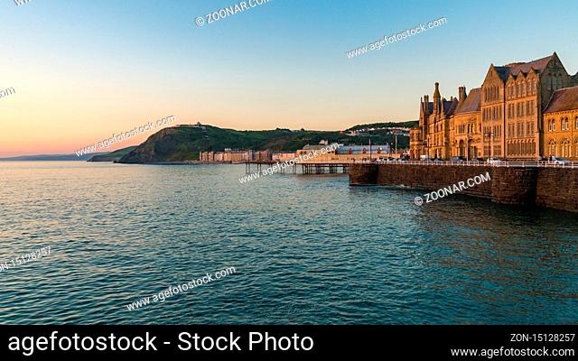 Aberystwyth, Ceredigion, Wales, UK - May 25, 2017: Evening view over the Marine Terrace with Yr Hen Goleg (Aberystwyth University Old College) on the right
