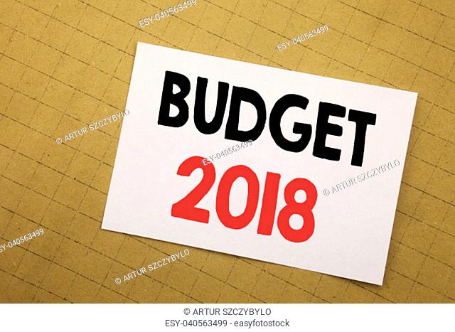 Conceptual hand writing text caption inspiration showing Budget 2018. Business concept for Household budgeting accounting planning Written on sticky note yellow...