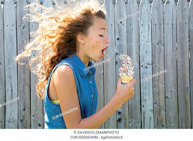 Teenage girl holding ice cream cone