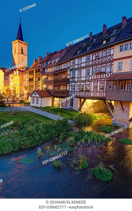 The famous Kraemerbruecke with its historic houses in Erfurt, Germany, at dusk