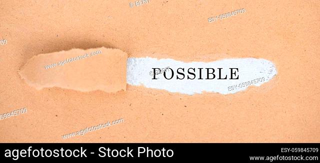 The word possible is standing on a white background, ripped textured paper