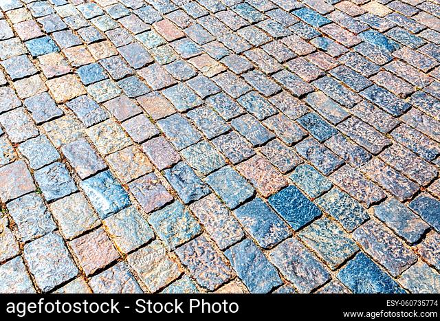 Abstract background of cobblestones making from rough stone blocks