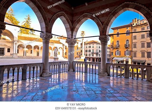 Ancient Italian square arches and architecture in town of Udine, Piazza della Liberta square, Friuli Venezia Giulia region of Italy