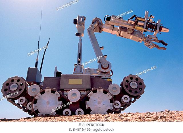 An Explosive Ordnance Disposal Robot Outstretches its Boom