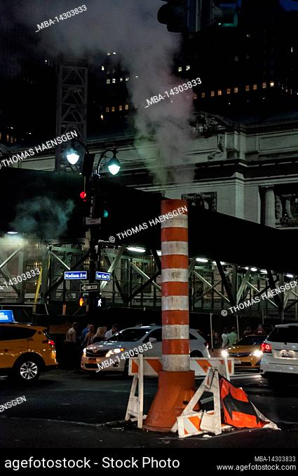 Grand Central Terminal, New York City, NY, USA, The typical New York City street view with the white-orange striped steam vent in the middle of the street