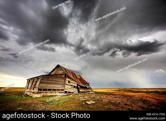 Abandoned, decaying barn, approaching powerful thunderstorm that spawned a funnel cloud, Colorado