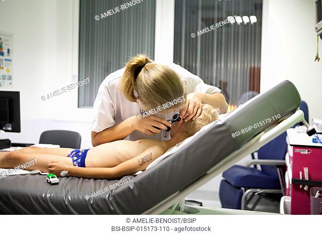 Reportage in the pediatric emergency unit in a hospital in Haute-Savoie, France. A doctor examines a young patient