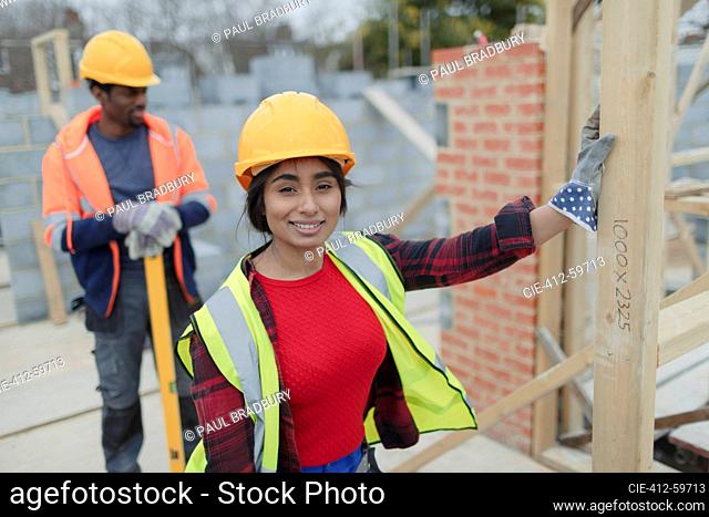 Portrait confident female construction worker at construction site