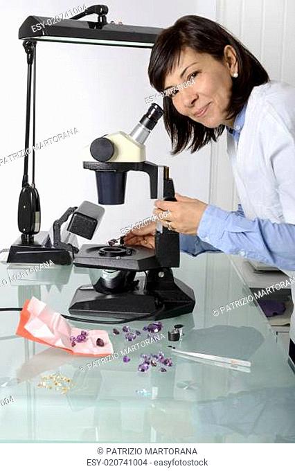Woman appraiser gems in laboratory