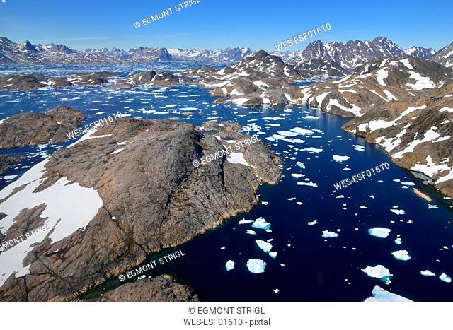 Greenland, East Greenland, Aerial view of Ammassalik island and fjord with pack or drift ice