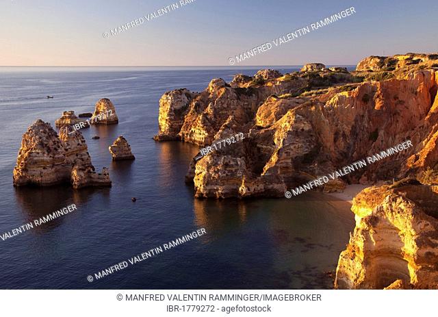 Rugged rocky shores in the early morning light, Lagos, Algarve, Portugal, Europe