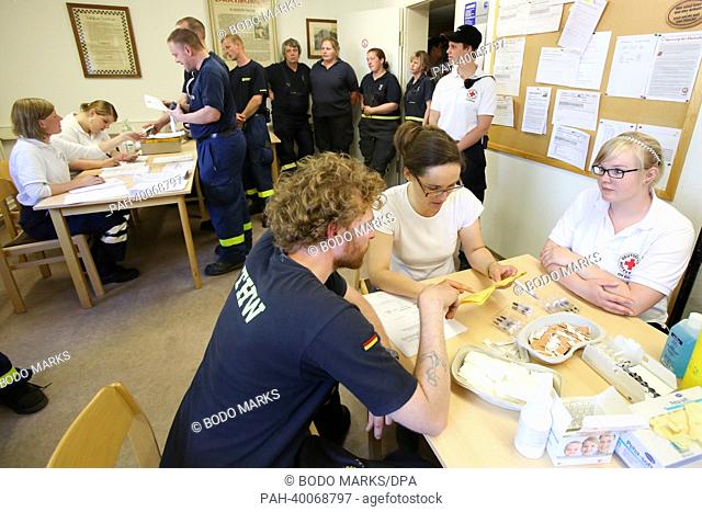 Rescue workers are vaccinated by the Red Cross in Lauenburg, Germany, 07 June 2013. The vaccinations are to prevent the risk of catching hepatits