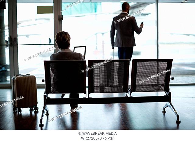 Businesspeople in waiting area at airport terminal