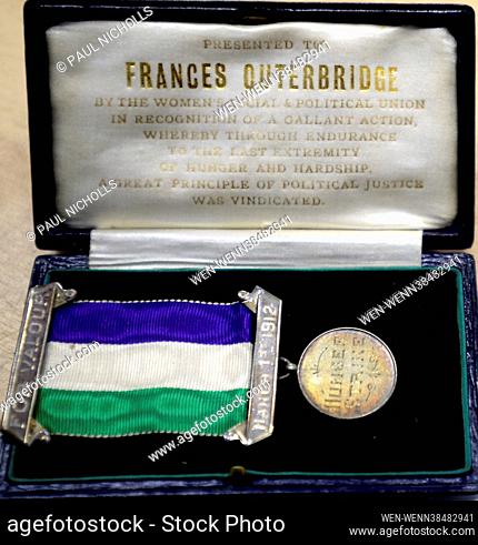 Nick Bowkett, Director/Auctioneer at Stroud Auction Rooms in Gloucestershire, with a Hallmarked silver suffragette Hunger Strike medal awarded to Frances...