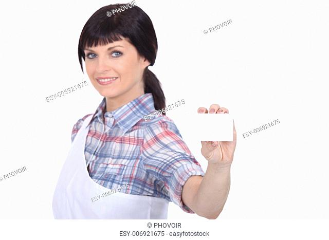 female butcher showing a business card