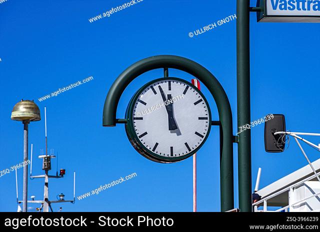 The harbour clock shows 3 to 12 and draws attention to the departure and arrival times of the ships, Strömstad, Bohuslän, Västra Götalands län, Sweden