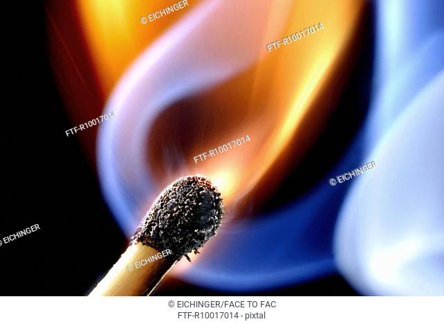 Close up of an ignited matchstick