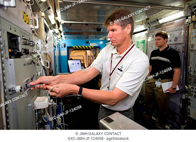 Russian Federal Space Agency cosmonaut Gennady Padalka (foreground), Expedition 19 commander, participates in a training session in the International Space...