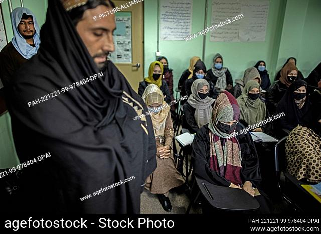 17 November 2022, Afghanistan, Kabul: Taliban standing in a classroom of a police barracks where women are being trained as police officers