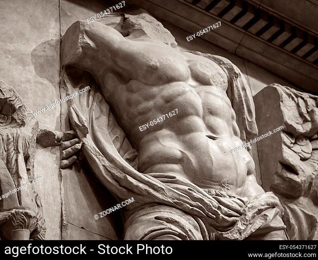 marble bas-relief of ancient man muscle torso