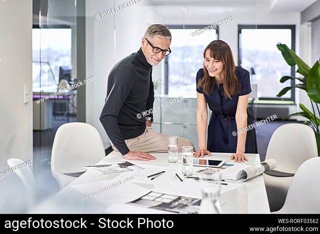 Two creative business colleagues working on a project in office