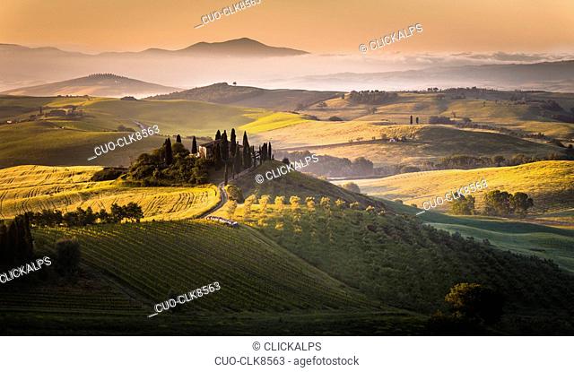 Sunrise over the farmhouse and the hills, Podere Belvedere, San Quirico d'Orcia, Val d'Orcia, Tuscany, Italy, Europe