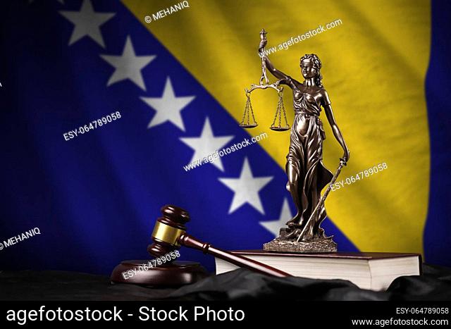 Bosnia and Herzegovina flag with statue of lady justice, constitution and judge hammer on black drapery. Concept of judgement and punishment