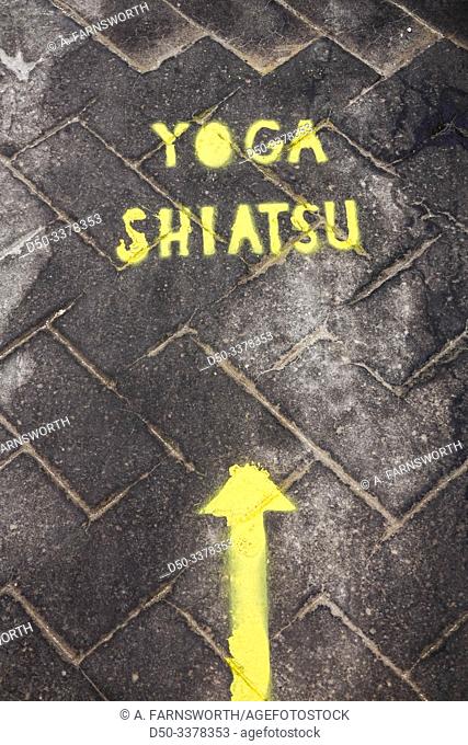 Syracuse, Sicily, Italy A sign on the pavement for Shiatsu Yoga