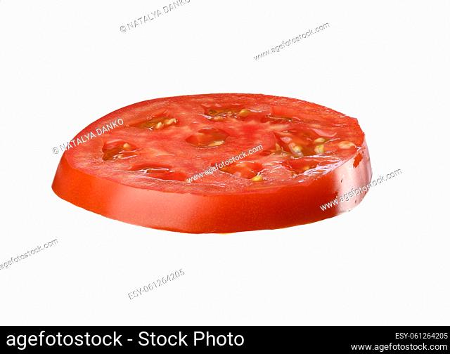 Round piece of red ripe tomato isolated on white background, close up