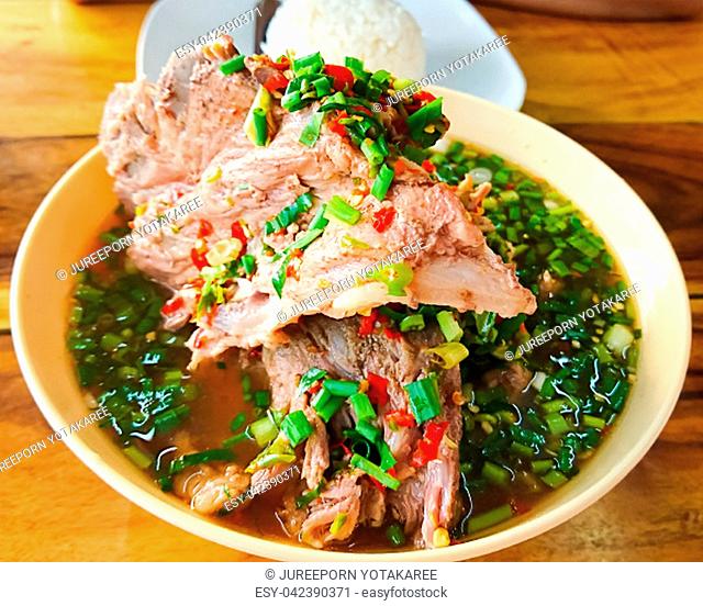Hot and spicy soup with pork neck bones and Thai herbs that we called ""LENG SAP"". This is one of the most popular food in Thailand