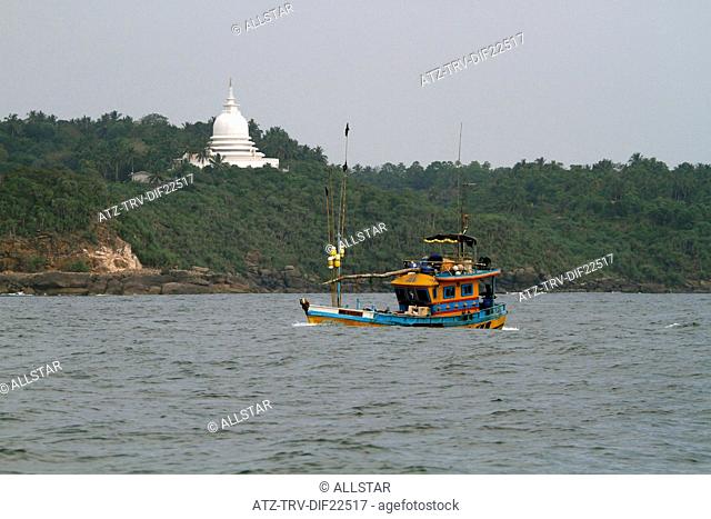 FISHING BOAT & JAPANESE PEACE PAGODA; INDIAN OCEAN, SRI LANKA, ASIA; 18/03/2013