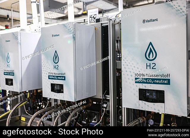PRODUCTION - 11 December 2023, North Rhine-Westphalia, Remscheid: Hydrogen heating appliances run on a test stand in the laboratory of the manufacturer Vaillant