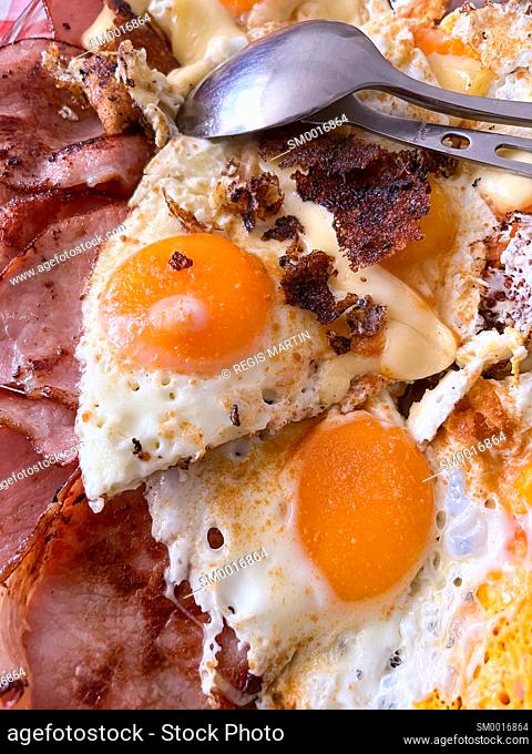bacon and eggs with cutlery
