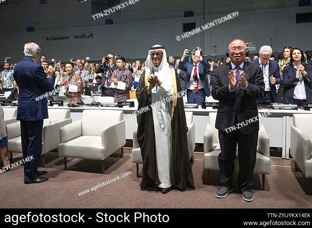 DUBAI 20231213 The agreement is finalized at COP 28. From left, US climate envoy John Kerry, Saudi Arabia's energy minister Abdulaziz bin Salman and China's...