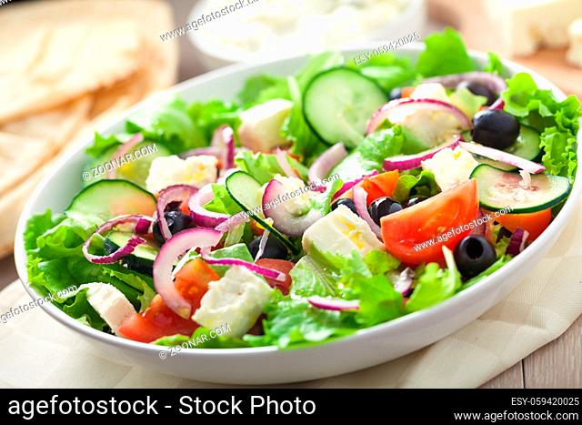Greek salad with tomatoes, feta, olives and cucumbers