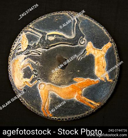 Egypt, Cairo, Egyptian Museum, spinning disk from the tomb of Hemaka, Saqqara, first dynasty, with dogs hunting gazelles