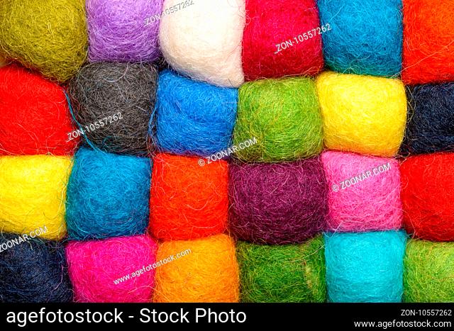 color wool background - balls of syntetic wool yarn - geometric rainbow pattern