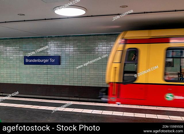 Berlin, Germany - 25 August 2020: a blurred subway train enters the Brandenburg Gate station in Berlin