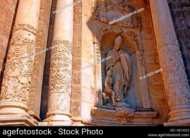 religious image of the baroque sculptural altarpiece of Puerta de los Hierros, Cathedral of Santa Maria, Valencia, Spain