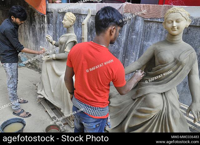 Idol artists are busy preparing the Goddess Saraswati Idol for the Saraswati Puja Festival in Sylhet, Bangladesh