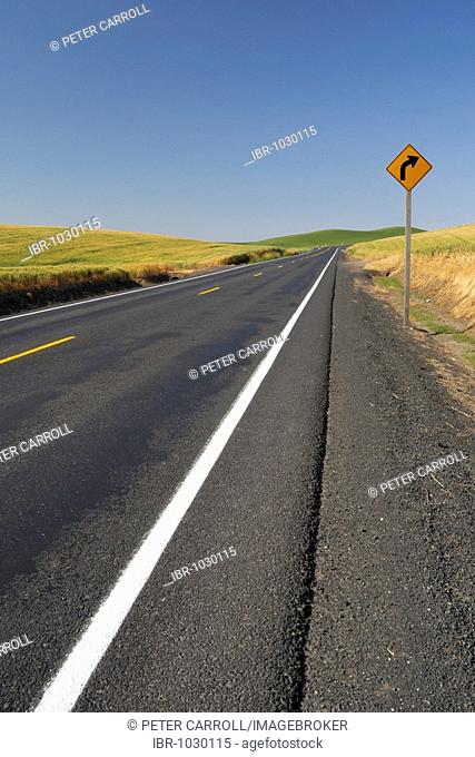 Blacktop country road extending off into the distance, Palouse, Washington, USA