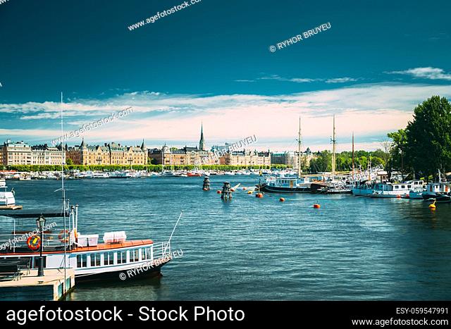 Stockholm, Sweden. Touristic Pleasure Boats Moored Near Piers In Sunny Summer Day