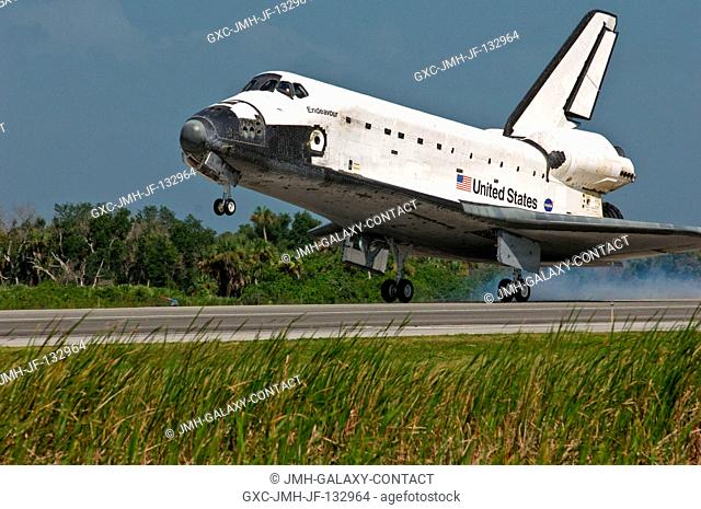 Space Shuttle Endeavour touches down on landing Runway 15 of the Shuttle Landing Facility at NASA's Kennedy Space Center, concluding the 16-day, 6