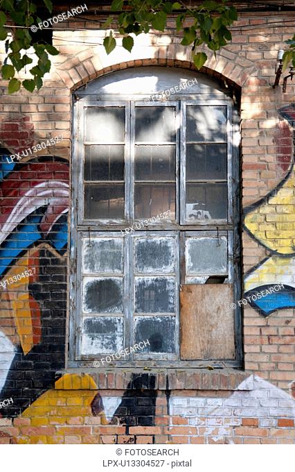 Abandoned window of an old factory at the 798 Space, Dashanzi Art District, Dashanzi, Chaoyang District, Beijing, China