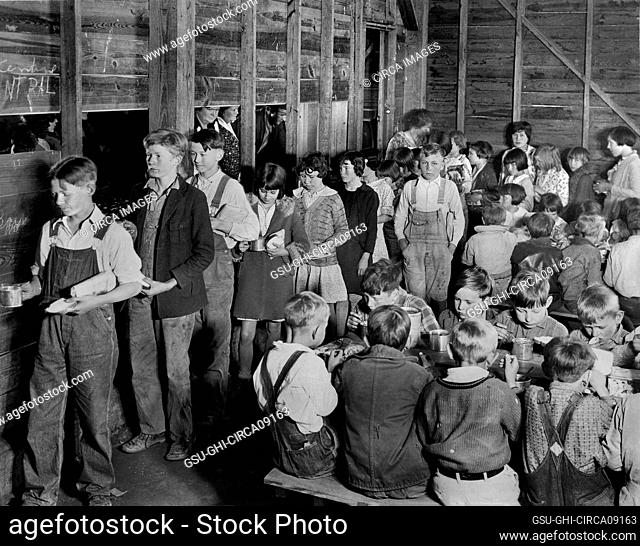 American Red Cross Volunteers cooking and serving Lunch to Rural Schoolchildren, all Drought Victims, Lonoke County, Arkansas, USA, Lewis Wickes Hine