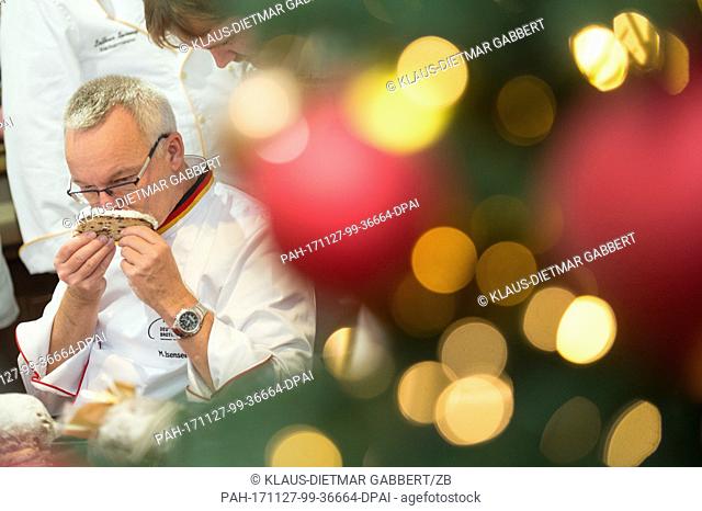 Michael Isensee, Stollen tester of the German Bread Institute, smells a butter stollen in Magdeburg, Germany, 27 November 2017