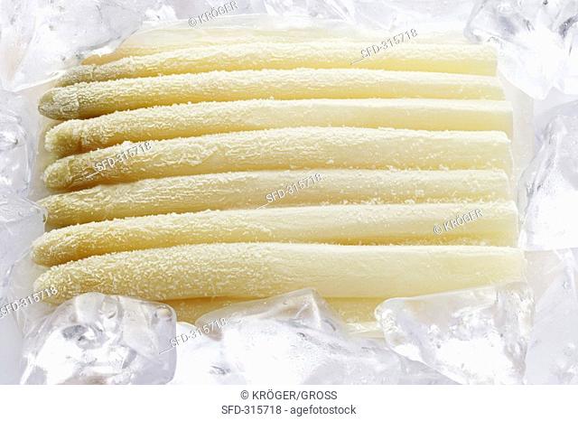 Frozen asparagus on ice