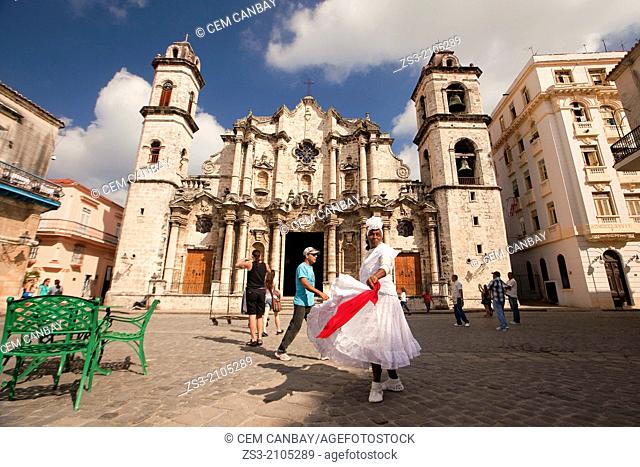 Santeria woman dancing in front of Cathedral of San Cristobal, Havana Vieja, Old Havana District, Havana, Cuba, West Indies, Central America