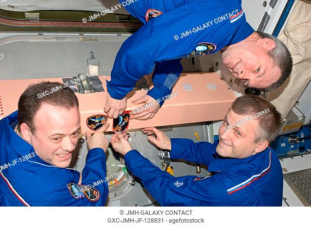 In the Unity node, Expedition 28 crew members add the Expedition 28 patch to the growing collection of insignias representing crews who have worked on the...
